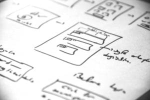 planning web design project on paper phone drawing