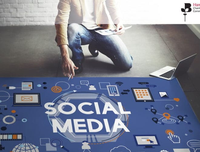 Man planning social media strategy with a large chart on the floor - Join our social media for beginners workshop on 14th July 2020