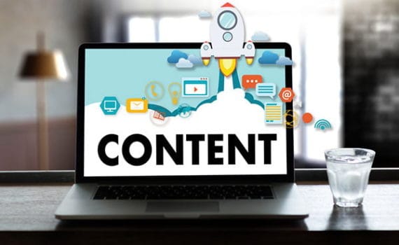 Laptop screen with vector images and 'Content' written on it - SEO content writing in 2020