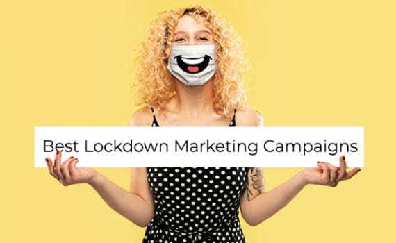 Woman wearing a mask with a laughing mouth printed on it, holding a sign that says 'Best Lockdown Marketing Campaigns'