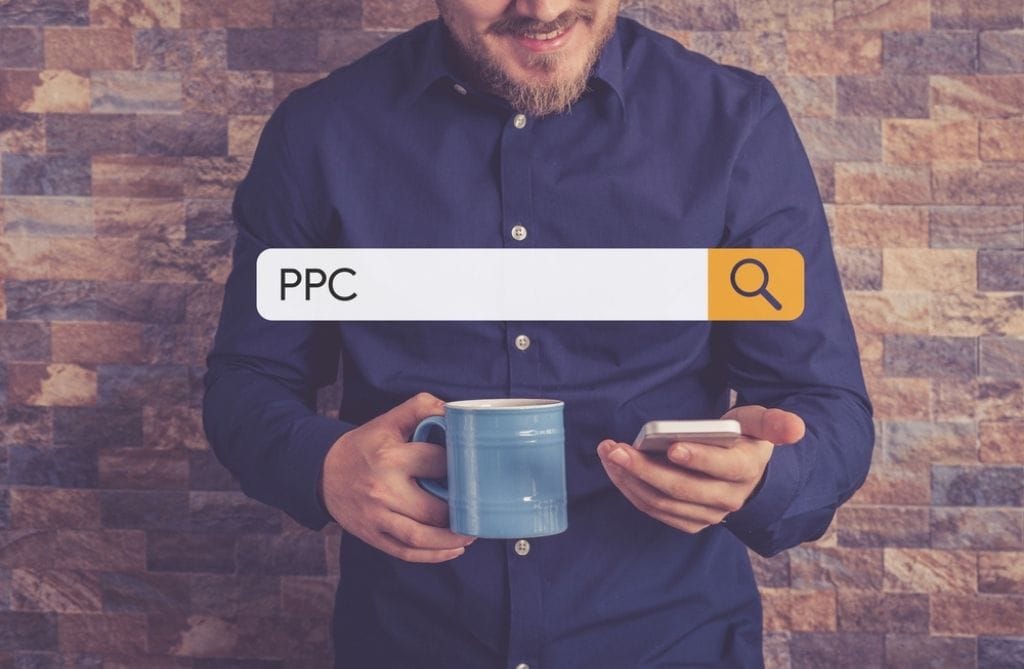 A man searches for PPC on his phone