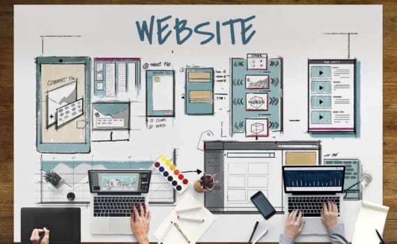 A schematic of a website laid out on a table