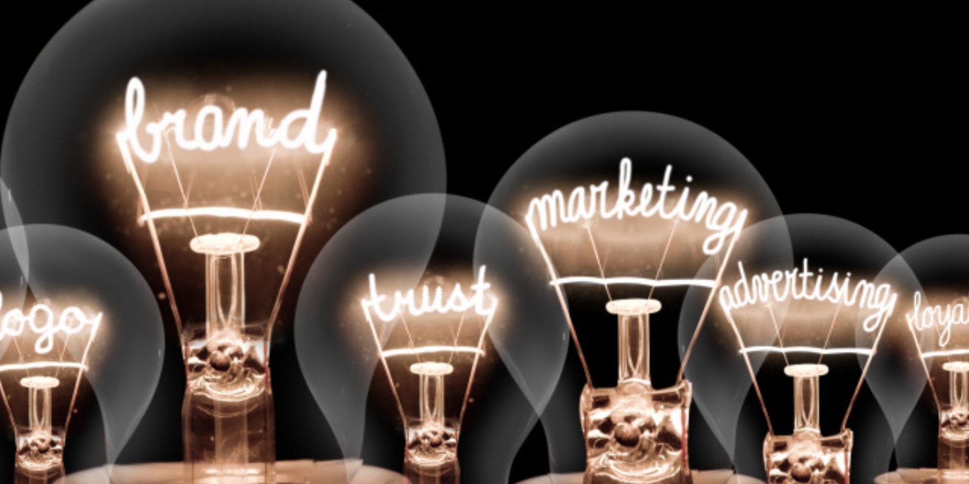 selection of lightbulbs with filaments showing marketing terms like 'brand' and 'marketing'