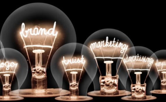 selection of lightbulbs with filaments showing marketing terms like 'brand' and 'marketing'