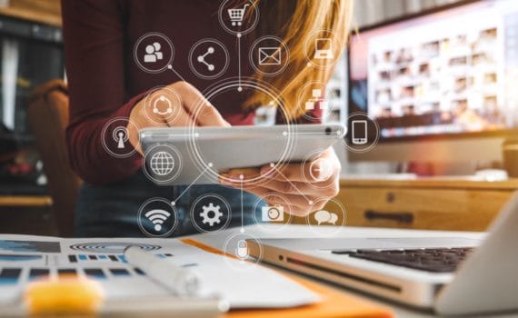 A small business owner carrying out digital marketing on a tablet