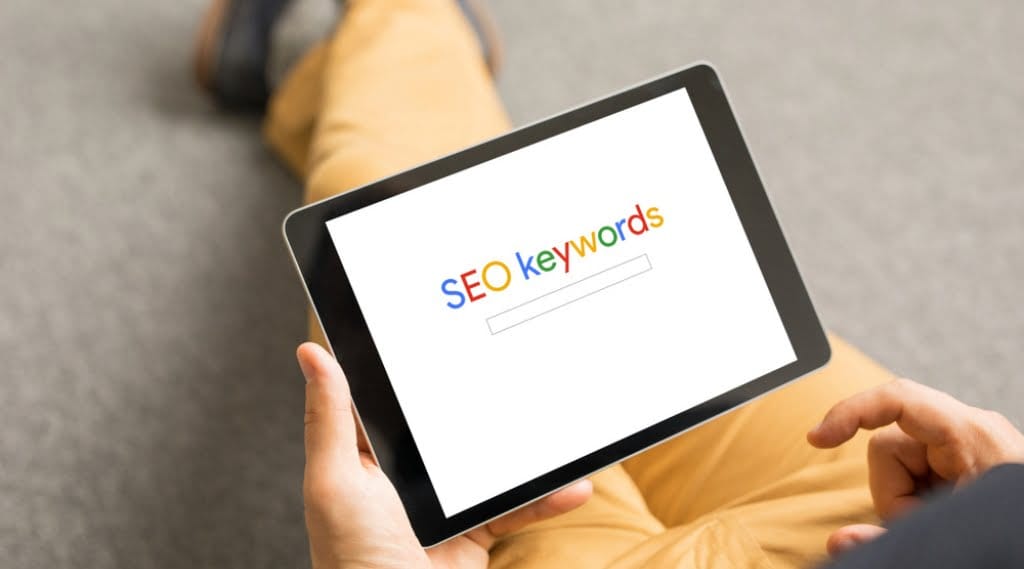 stylised image of someone using SEO on a search engine