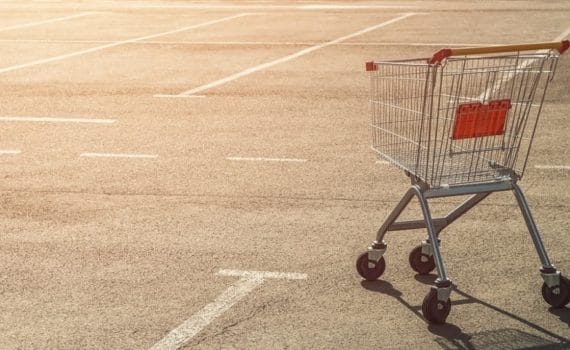 an abandoned shopping trolley/cart in a car park