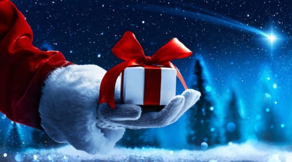 A festive, santa-esque hand holding a gift