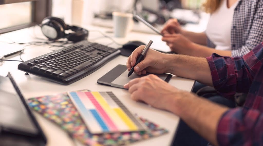 A web designer working at a desk