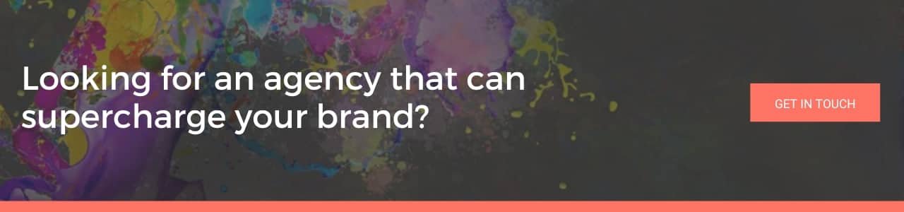 Bold white text reads “Looking for an agency that can supercharge your brand?” over a dark background with bright paint splashes and a coral "Get In Touch" button.