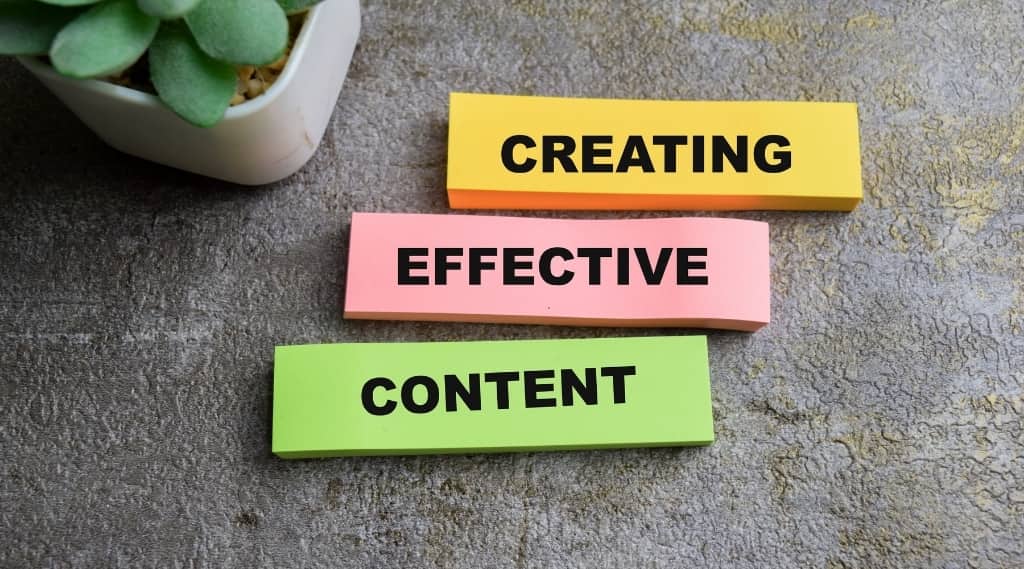 Sticky notes on desk showing the words creating effective content