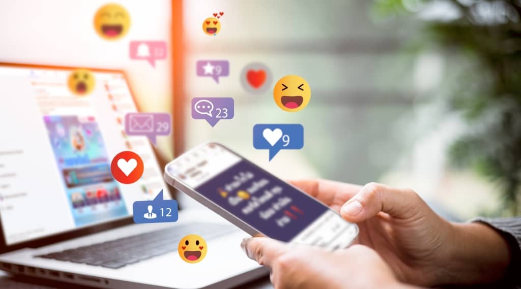 Person using smartphone with floating reaction icons, representing social search in social media marketing.
