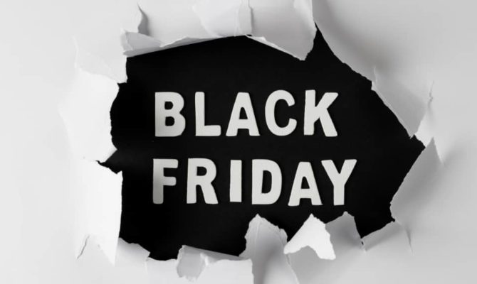 Bold Black Friday PPC promotion design with ripped paper effect background.