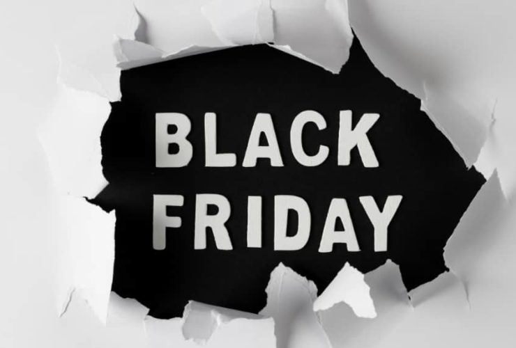 Bold Black Friday PPC promotion design with ripped paper effect background.
