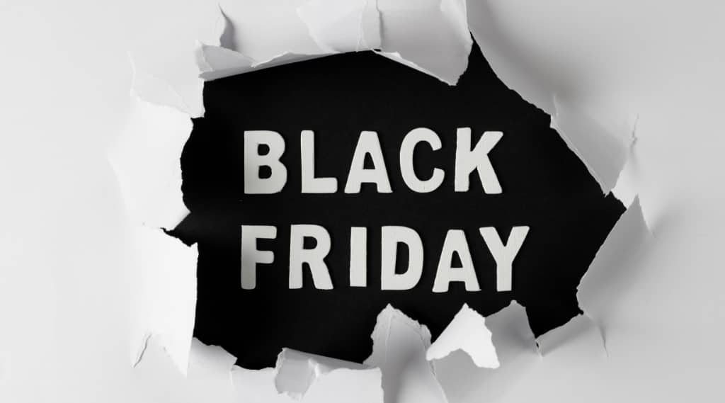 Bold Black Friday PPC promotion design with ripped paper effect background.