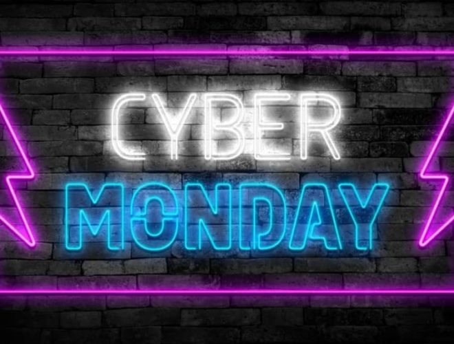 Neon sign displaying Cyber Monday Ads promotion with bright purple and blue lights.