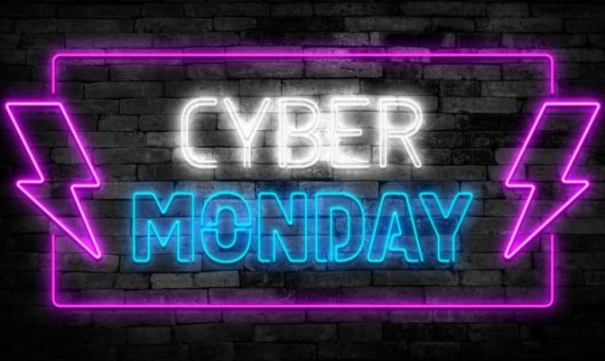 Neon sign displaying Cyber Monday Ads promotion with bright purple and blue lights.
