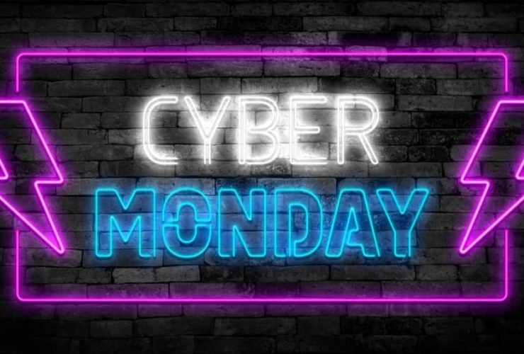 Neon sign displaying Cyber Monday Ads promotion with bright purple and blue lights.