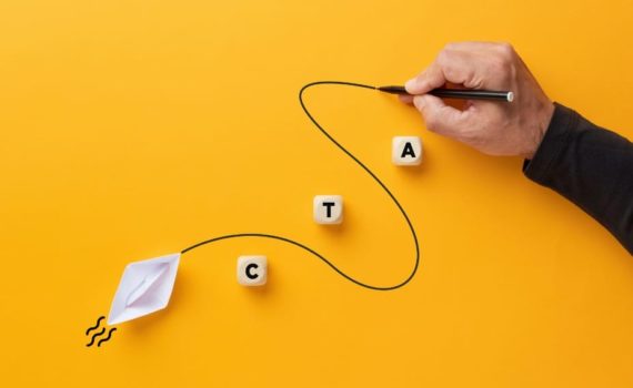 call to action mistakes, a hand drawing a winding line from a paper boat towards wooden blocks spelling CTA on a yellow background