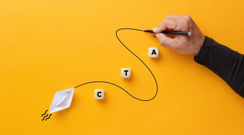 call to action mistakes, a hand drawing a winding line from a paper boat towards wooden blocks spelling CTA on a yellow background