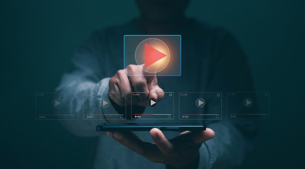 digital marketing trend video marketing, a person using a smartphone with a glowing play button and video interface icons hovering above it
