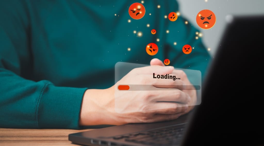 website design package to fix site speed, a person waiting with folded hands in front of a laptop displaying a slow loading bar and floating angry face icons