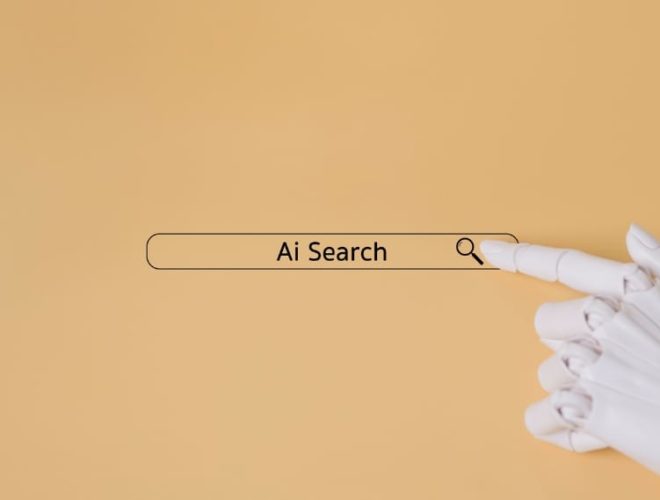 what is answer engine optimisation, a robotic hand pressing a search bar labelled Ai Search on a beige background