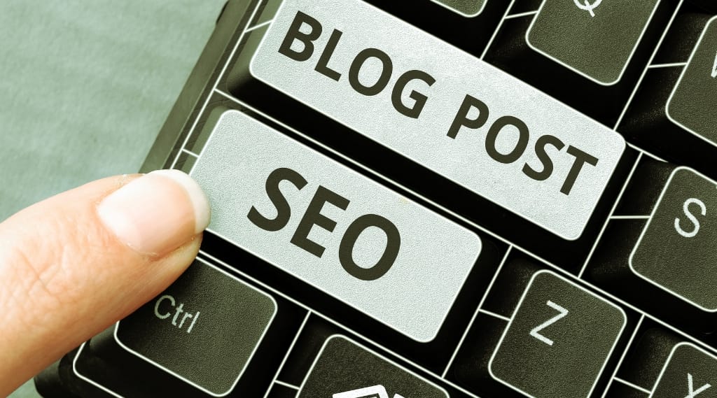 Does blogging help SEO: close-up of keyboard with SEO and blog post keys being pressed.