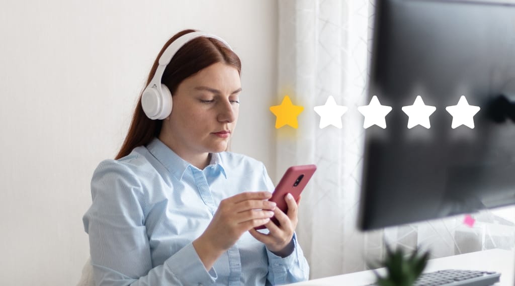 Problem with bad small business web design, Woman wearing headphones looking at her phone beside a low one-star rating graphic, illustrating the problem with bad small business web design and poor user experience.