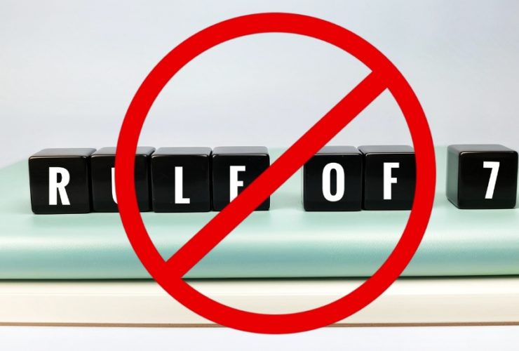 Marketing rule of 7: Black blocks spelling rule of 7 crossed out with red prohibition symbol representing outdated marketing theory