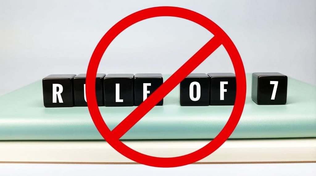 Marketing rule of 7: Black blocks spelling rule of 7 crossed out with red prohibition symbol representing outdated marketing theory