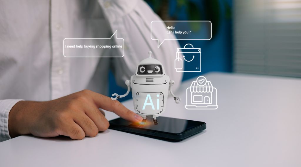 AI search optimisation for black friday deals: A person touches a smartphone on a desk as a friendly white robot marked “AI” appears to rise from the screen. Speech bubbles read “I need help buying shopping online” and “Hello, can I help you?”, with shopping bag and online shop icons alongside.
