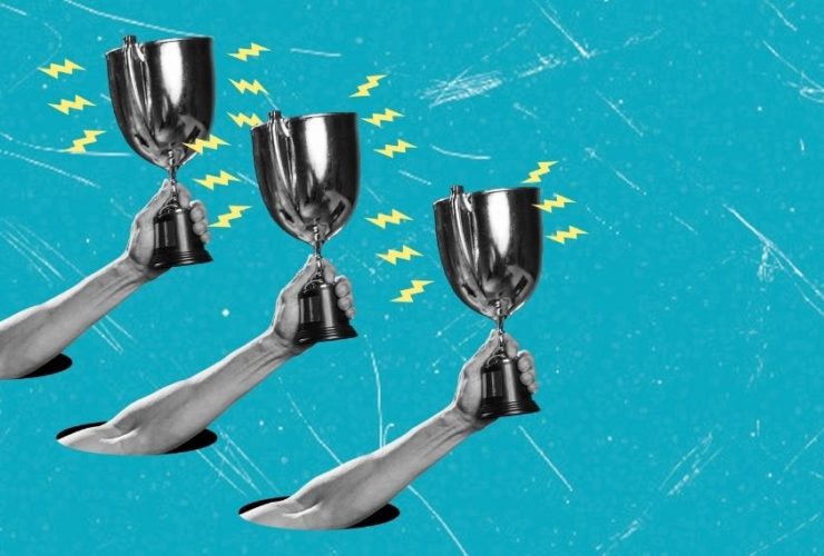 Web Excellence Awards 2026: Three black-and-white arms reach up through holes in a bright turquoise background, each raising a silver trophy cup surrounded by yellow lightning bolts.