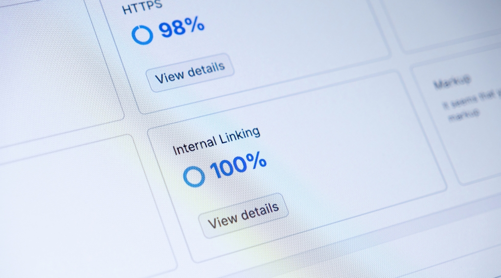 why isnt my website showing up on Google: A close-up of an SEO audit dashboard showing an HTTPS score of 98% and an internal linking score of 100%, highlighting the technical checks that affect whether a website shows up on Google.